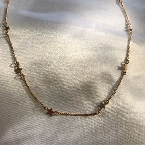 • Gold star necklace •